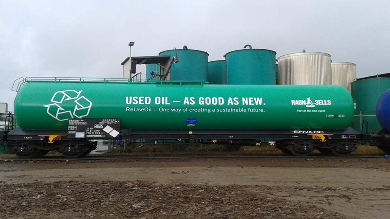 A green train that transports oil to Germany for regeneration